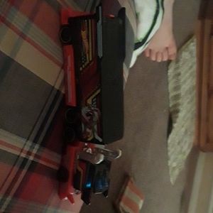 A toy 18-wheeler with a mystery car in it